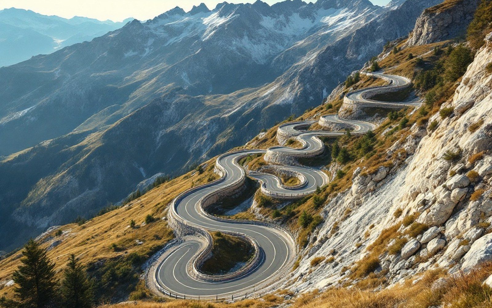 A bare alpine road climbing a slope in tight hairpins above the treeline